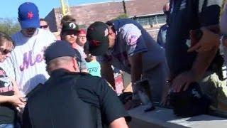 Tim Tebow Prays Over Fan Who Appears To Have A Seizure